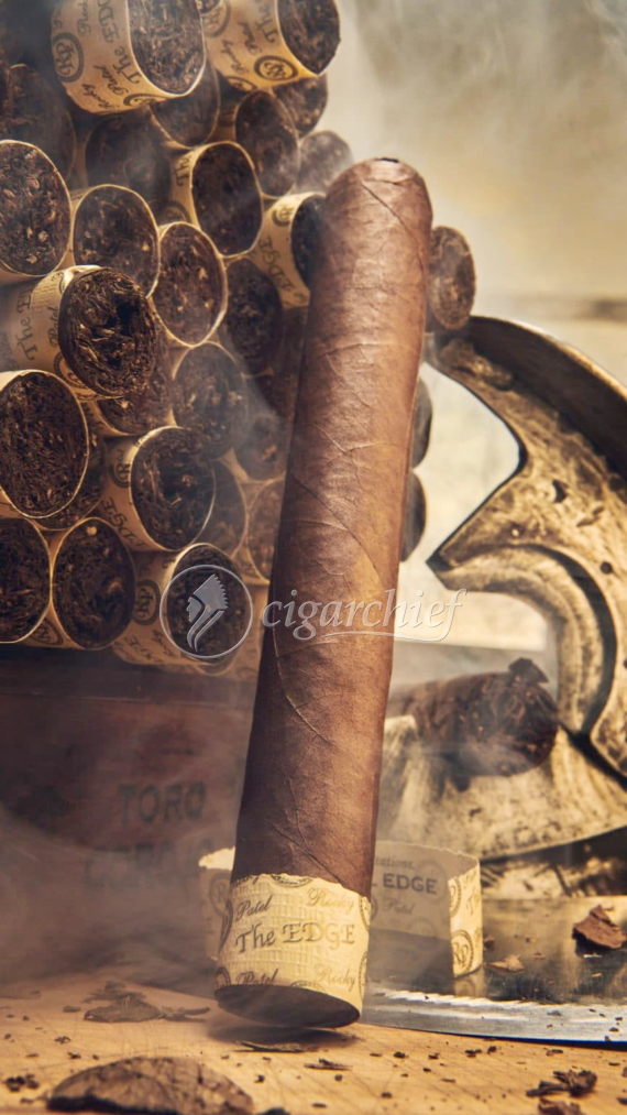 Rocky Patel Cigars The Edge Corojo Toro Single Cigar Leaning Against Bundle of Cigars Large
