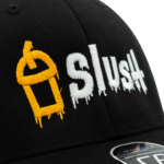 Close-up of Slush snapback hat embroidery showing gold cup and white dripping text logo