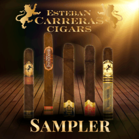 Five Esteban Carreras cigars displayed upright on a wooden stage with a spotlight. Each cigar shows a distinct band, including Chupacabra 10th Anniversary, Bloodline, Soga de Oro Maduro, Soga de Oro Sumatra, and Mr. Brownstone. Above them is the Esteban Carreras Cigars logo with a golden lion, and below is the word “Sampler” in bold gold lettering.