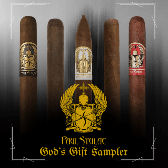 Five Paul Stulac cigars standing upright in a row on a dark gradient background. Each cigar has a distinct band design in gold, black, white, and red. Below the cigars is a golden Paul Stulac crest with wings and a skull, and the text “Paul Stulac God’s Gift Sampler” in a gothic font.