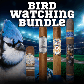 A promotional image for the Bird Watching Bundle by Cigar Chief, featuring four baseball-themed cigars — Rocky Patel Dark Star Short Stop, Fergie Jenkins FJ31, Jose Reyes Homeplate, and Gary Sheffield HR 500 — displayed in front of a lit baseball stadium. A close-up Blue Jay appears on the left, tying into the Blue Jays World Series excitement.