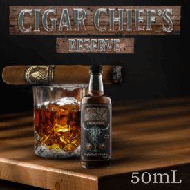 A dark, moody promotional image featuring the "CIGAR CHIEF'S RESERVE" logo on weathered wood at the top. The center features a large, stylized, melted metal bull skull graphic. Below the skull are two rocks glasses containing whiskey and ice. The text specifies "46% alc./vol." and "Single Malt Whiskey 50mL" at the bottom.